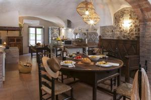 a kitchen with a table with food on it at Can Barrina in Ventalló