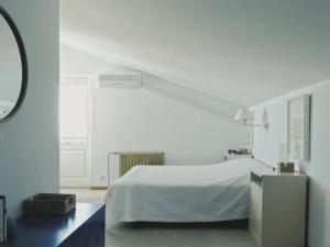 a white bedroom with a white bed and a window at Villa Marina in Brela +34 photos