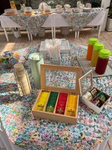 a table with a box of paints on top of it at Tenuta Santa Caterina in Rossano