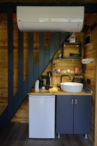 a kitchen with a sink and a counter top at LUSER BUNGALOW in Ardeşen +27 photos