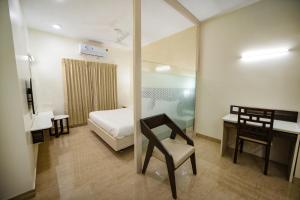 Postel nebo postele na pokoji v ubytování Avenue 11 Premium Stays Madurai