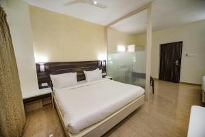 Postel nebo postele na pokoji v ubytování Avenue 11 Premium Stays Madurai