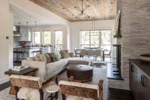 a living room with a couch and a table at Spanish Peaks Highlands Cabin 59 in Big Sky