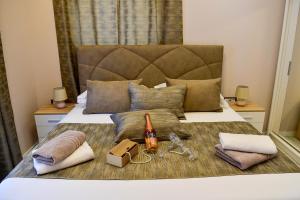 a bedroom with a bed with a bottle of beer and other items at Apartment Madonna in Dugopolje