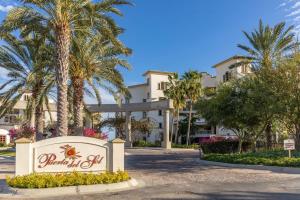 a sign in front of a resort with palm trees at Luxury retreat in Cabo del Sol golf and beach community in Cabo San Lucas