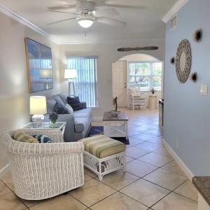 a living room with a couch and chairs at Beach Condo in Clearwater Beach