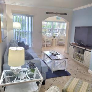 a living room with a couch and a tv at Beach Condo in Clearwater Beach