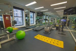 a gym with a large room with exercise equipment at Iroquois New York Times Square in New York