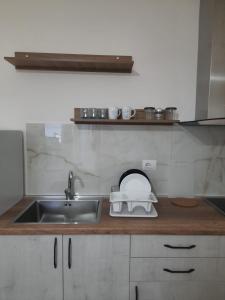 Η κουζίνα ή μικρή κουζίνα στο Devi's Apartment +1 φωτογραφίες