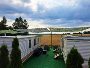 a couple of trailers parked next to each other at Pensjonat Łysa Góra in Zator