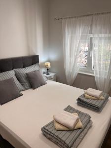 Ένα ή περισσότερα κρεβάτια σε δωμάτιο στο Apartments Loncar +51 φωτογραφίες