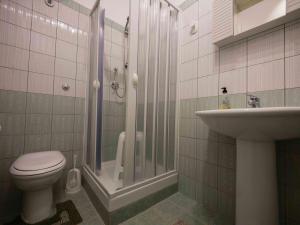 a bathroom with a shower and a toilet and a sink at Carlitos in Realmonte