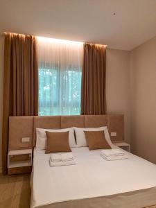 Postel nebo postele na pokoji v ubytování Solea Hotel