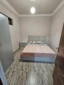 Postel nebo postele na pokoji v ubytování Туристический Дом в EVN Airport + 1 fotografie