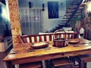 a wooden table with three baskets on top of it at Villamasai "Un pedacito de África en Valencia" in Valencia
