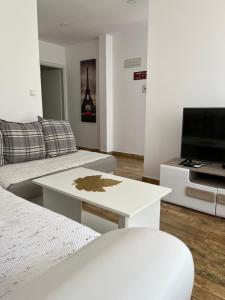 a living room with a couch and a coffee table at Demiri Rr in Ulcinj