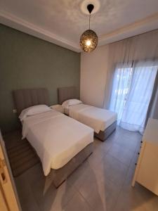 Voodi või voodid majutusasutuse COSTA MAR MARTIL 2 TETOUAN toas