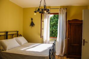 Postel nebo postele na pokoji v ubytování Agriturismo Dandelion