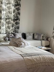 Ένα ή περισσότερα κρεβάτια σε δωμάτιο στο Le Chalet d'Ouchy