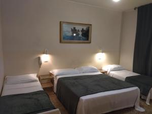 Postel nebo postele na pokoji v ubytování Pensione Trento
