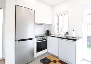 Køkken eller tekøkken på MyStay - Casa do Louro