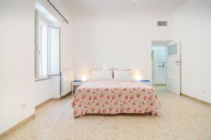 Ліжко або ліжка в номері Archetto al Trevio