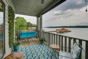 a balcony with a view of a body of water at Spacious Penthouse with Stunning Lakefront Views! in Hot Springs