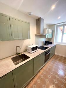 Køkken eller tekøkken på Maison Colonel Teyssier