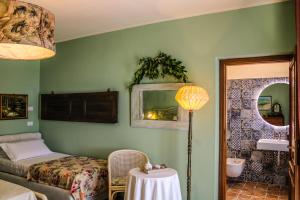 Postel nebo postele na pokoji v ubytování Agriturismo Dandelion
