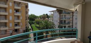 a balcony with a view of some buildings at Port FREJUS OPEN 2 pieces 40m2 in Fréjus