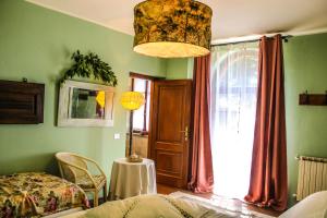 Postel nebo postele na pokoji v ubytování Agriturismo Dandelion