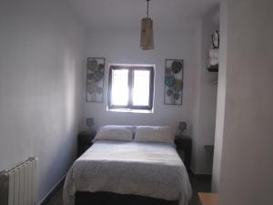 Ένα ή περισσότερα κρεβάτια σε δωμάτιο στο Casa Mis Mellizos