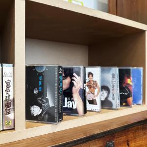 a shelf with dvds on it at 衛民居 wei min stay in Tainan