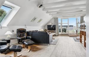 a living room with a couch and chairs at Holiday Apartment Skagen 01 in Skagen
