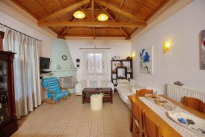 a living room with a couch and a table at Albatros Villa in Alonnisos