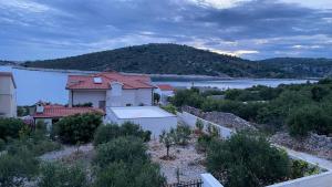 a house with a view of a body of water at Markioli Residence in Sevid
