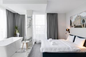 Posteľ alebo postele v izbe v ubytovaní Be The One Hotel