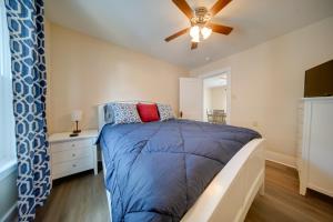 a bedroom with a bed and a ceiling fan at Ashtabula Vacation Rental with Covered Balcony in Ashtabula