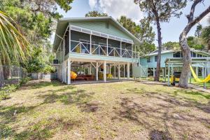 a large house with a playground in front of it at Crystal River Retreat with Private Dock and Kayaks! in Crystal River