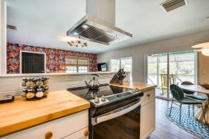 a kitchen with a stove and a counter top at Crystal River Retreat with Private Dock and Kayaks! in Crystal River