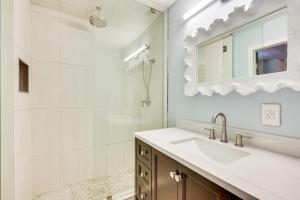 a bathroom with a sink and a mirror at Crystal River Retreat with Private Dock and Kayaks! in Crystal River