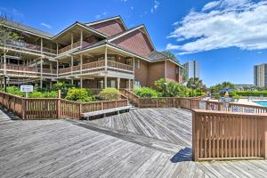 a house on a wooden deck with a pool at Private Deck & Pool Access: Myrtle Beach Getaway! in Myrtle Beach