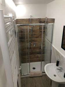a bathroom with a shower and a sink at Casa Vacanze SANGALLO in Nettuno