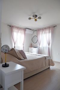 Postel nebo postele na pokoji v ubytování Casa Tenedos Corfu