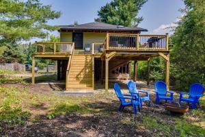 a house with blue chairs in front of it at Fairhaven Harbor-Front Gem - Steps From the Water! in Fairhaven