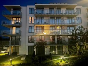Vonkajšia záhrada v ubytovaní Tuż przy plaży - nowoczesny apartament z tarasem i pięknym widokiem na Bałtyk