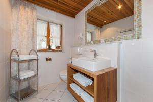 a bathroom with a sink and a toilet at Ferienhaus Alpenblick in Mittenwald +48 photos