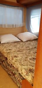 Postel nebo postele na pokoji v ubytování coté plage caravane front de mer