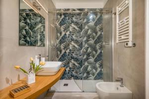 a bathroom with a sink and a shower at Suite Altamarea "Sea View Studios" in Castellammare del Golfo +50 photos