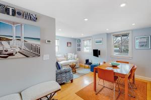 a living room with a table and a couch at The Bradford Bistro in Provincetown